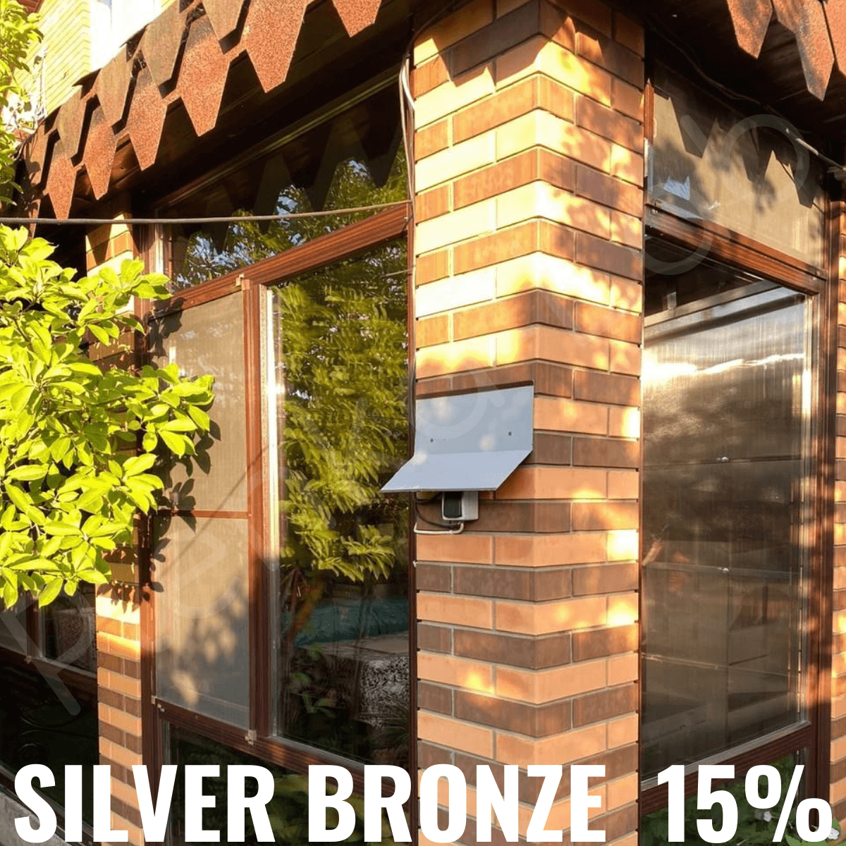 <img src="bronze_outside_20.jpg" alt="Зеркальная плёнка, здание с плёнкой Bronze 20%">